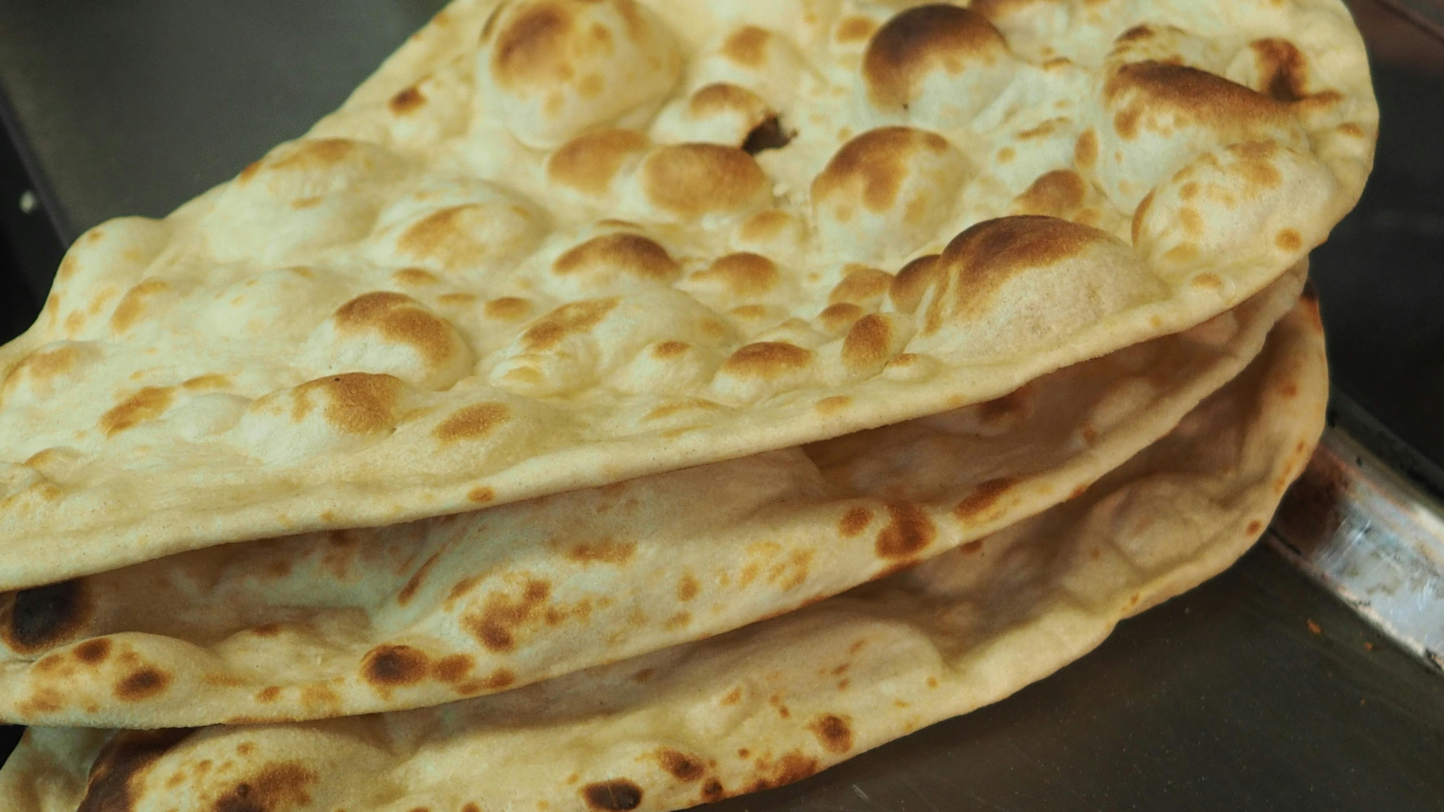 Free stock photo of cooking, cooking naan bread, naan