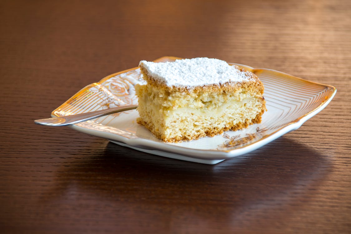 Brown and White Sliced Cake on White and Brown Ceramic Plate