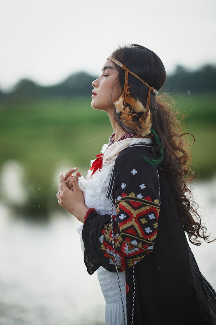 Woman In Black And White Jacket Holding White Flower