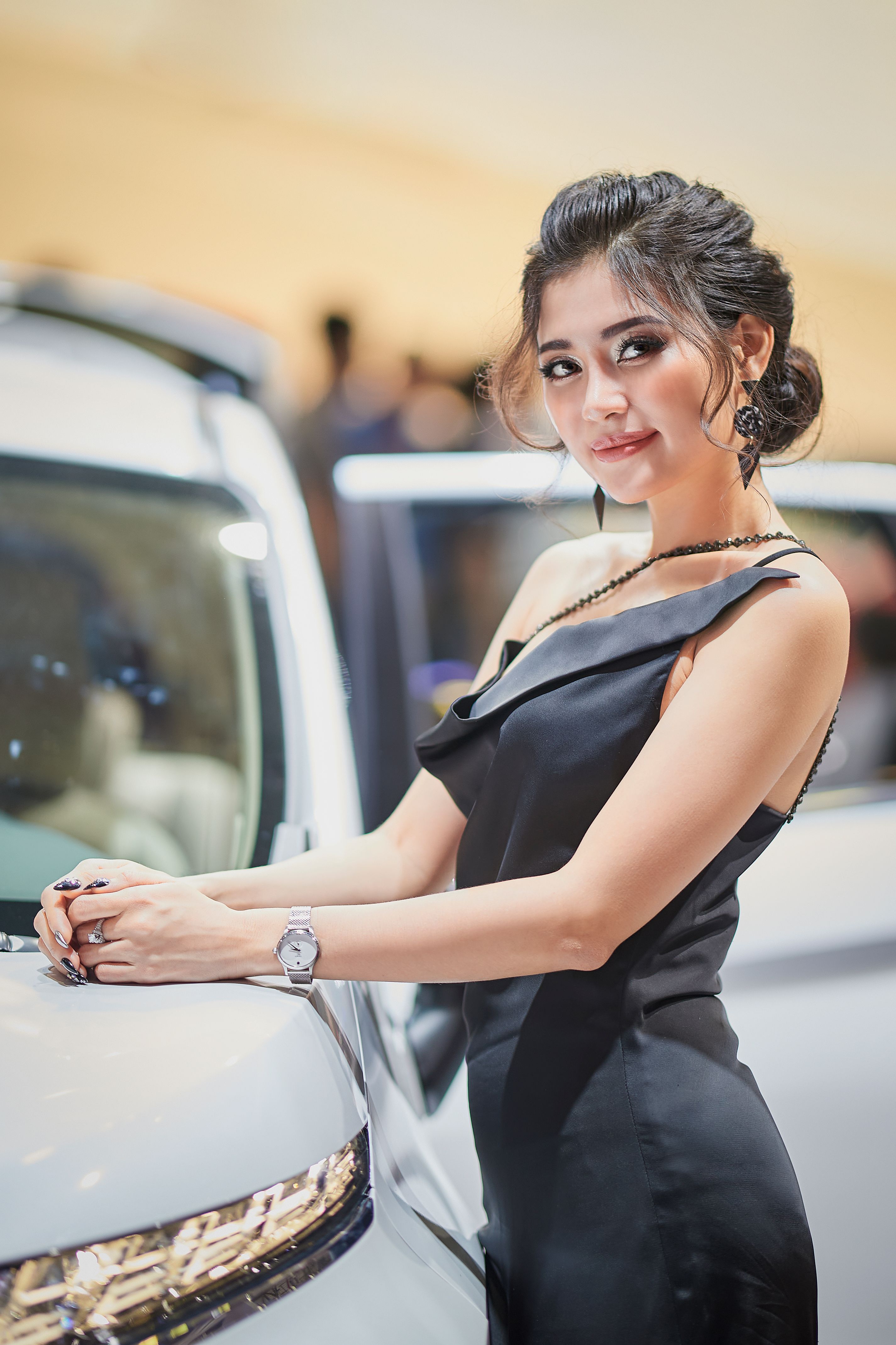 Woman in Black Dress Standing Beside a Car · Free Stock Photo