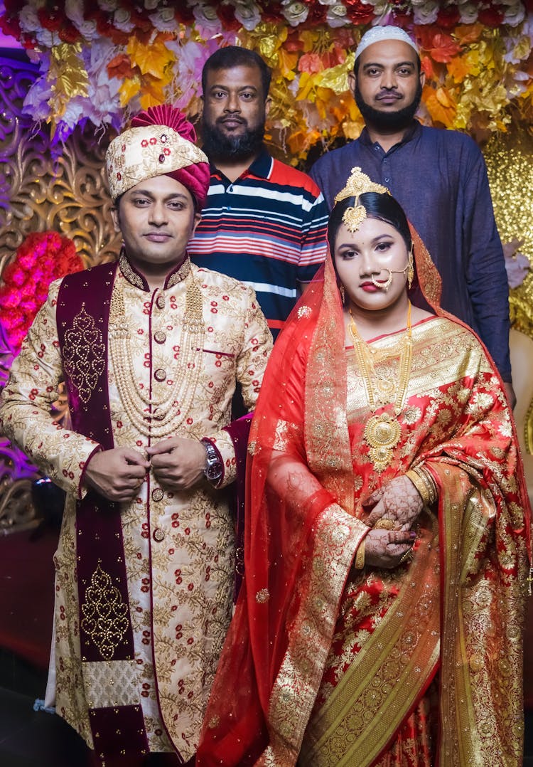 A Group Of People In Traditional Dresses