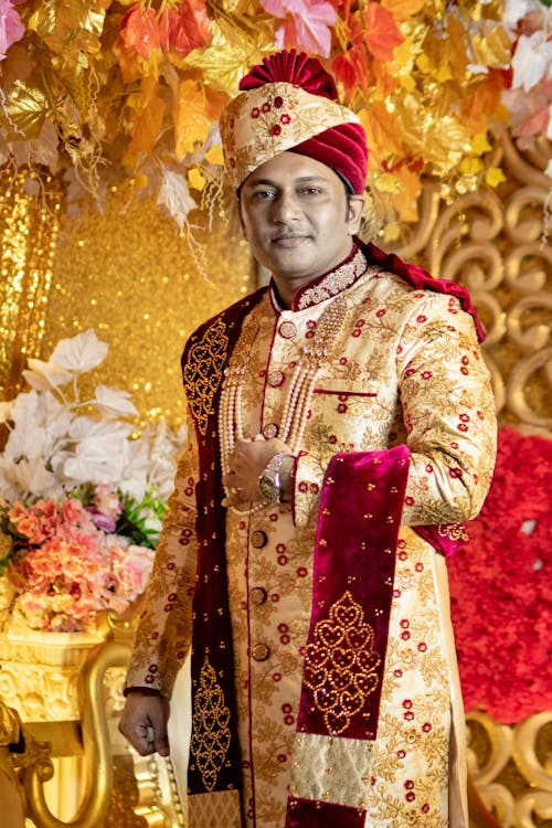 Man in Red and Gold Floral Traditional Dress Free Stock Photo
