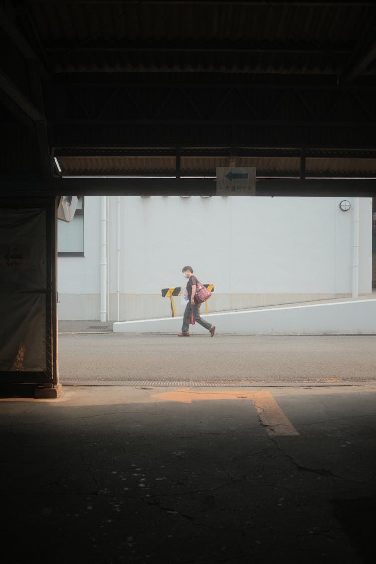 Person Walking In An Empty Road 