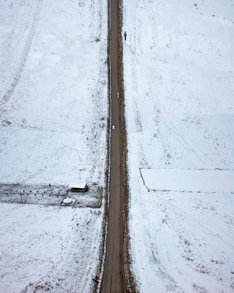 Mud On A Road Surrounded By Snow