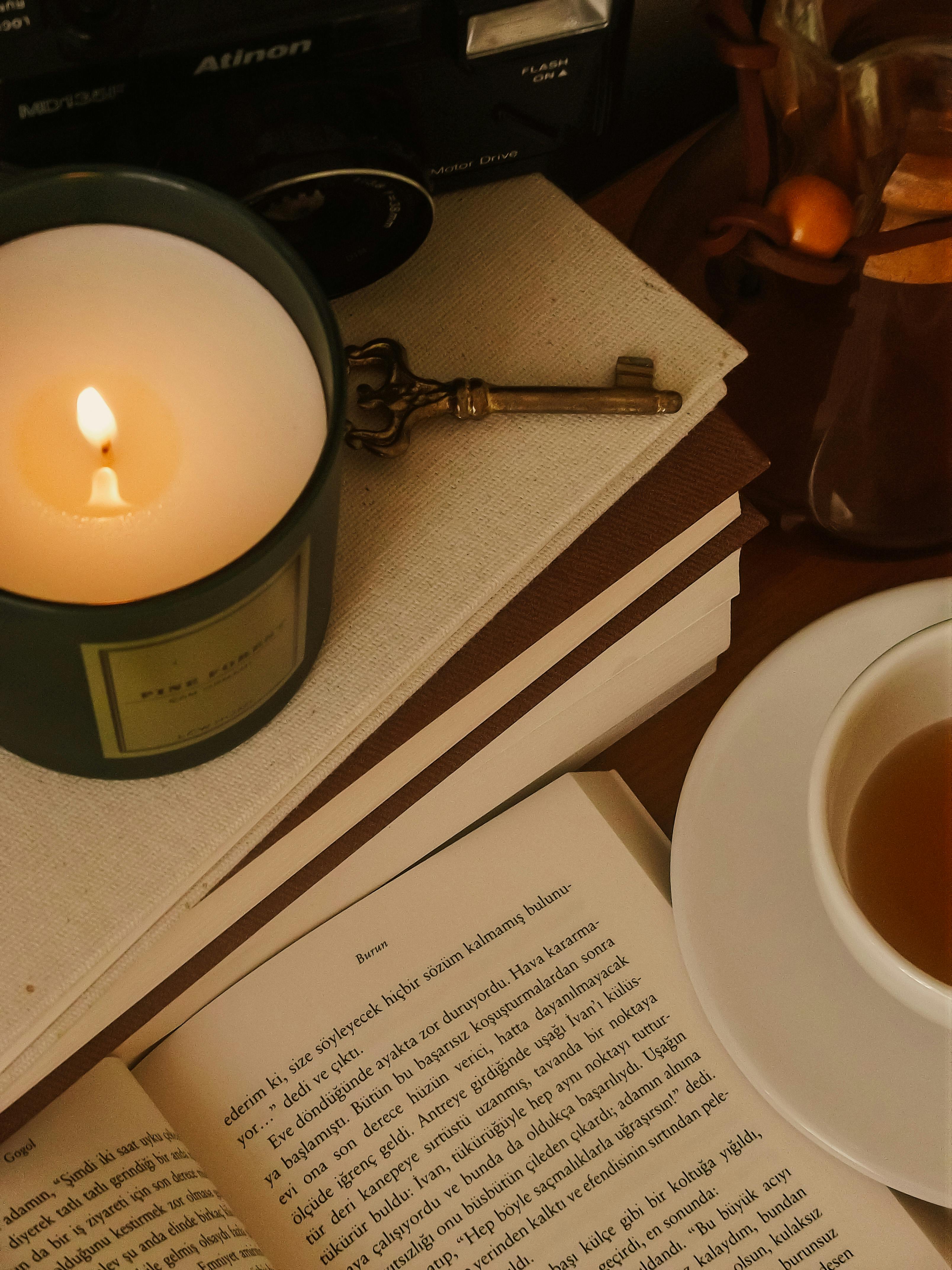 Book, Tea and Burning Candle · Free Stock Photo