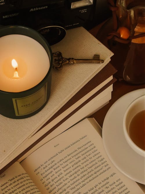 Free Book, Tea and Burning Candle  Stock Photo