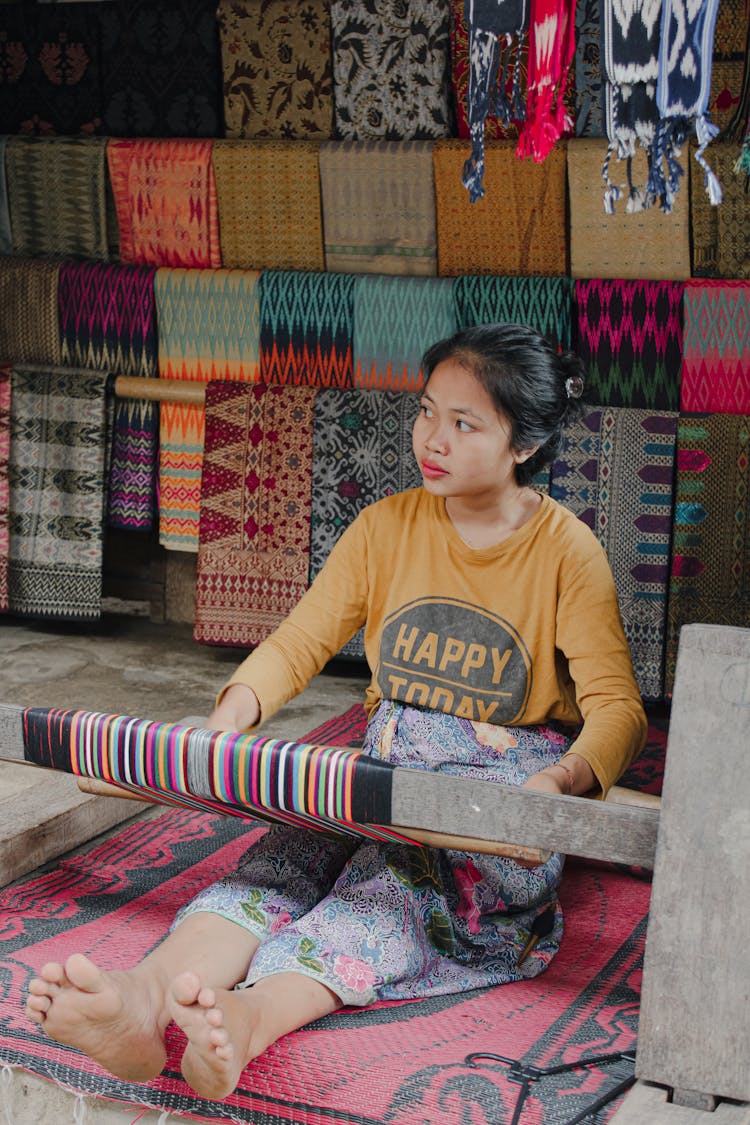 A Woman Weaving Cloth