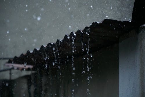 Rainwater Flowing From Roof