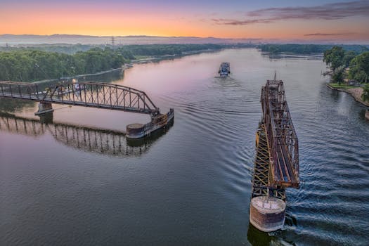 Captivating aerial view of the historic swing bridge in La Crescent, Minnesota during sunset.