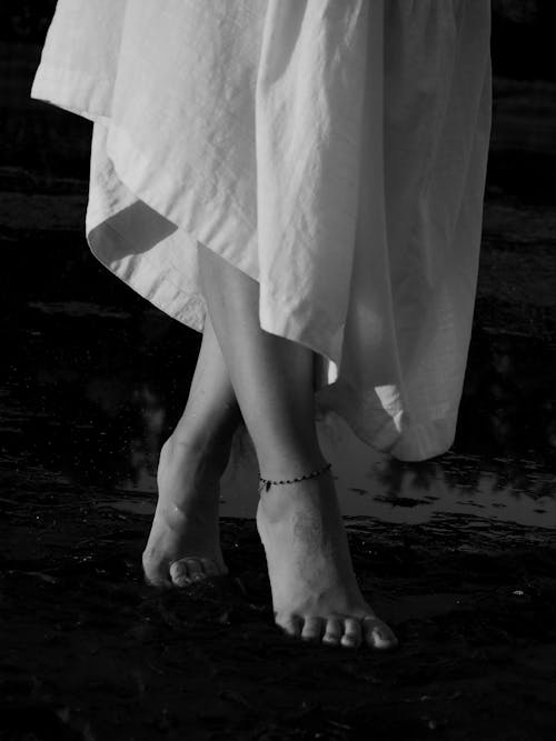 Grayscale Photo of Barefooted Person