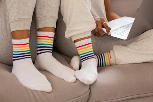 Free Close-up Photo of People wearing Pride Colored Socks  Stock Photo
