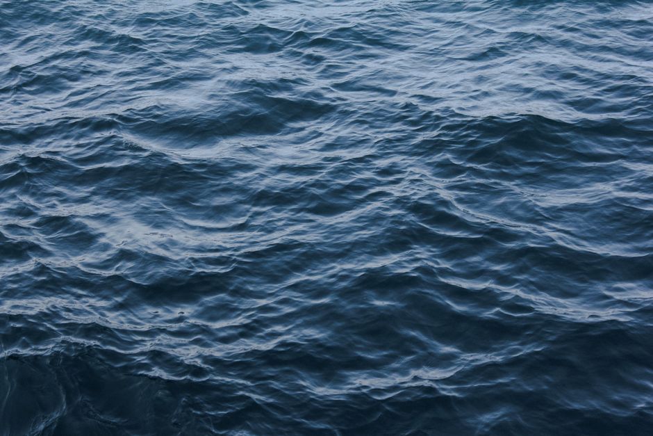 A serene view of ocean waves creating intricate ripples on the seawater surface.