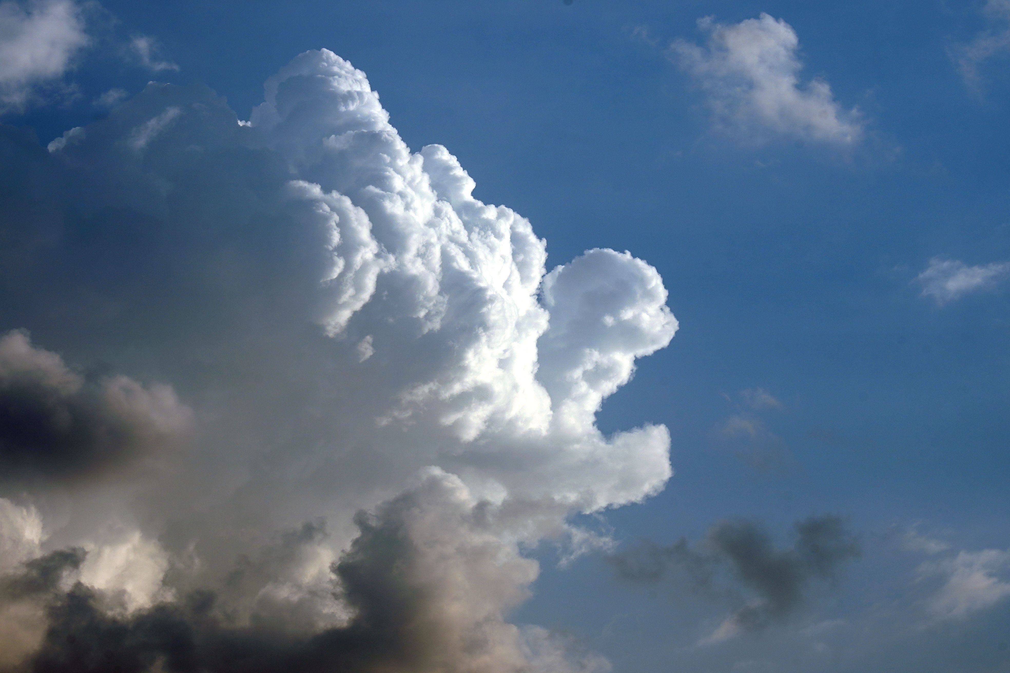 A stunning view of cumulus clouds with a bright blue sky, showcasing the beauty of nature.