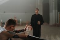 A Tattooed Man Praying