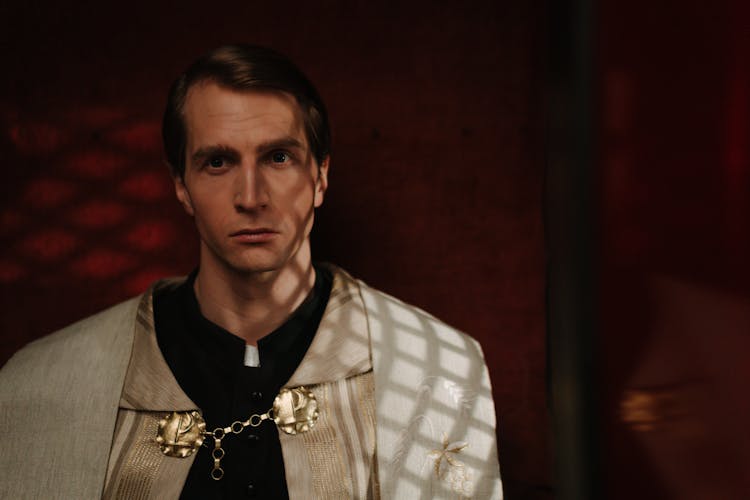 Priest Inside A Confessional