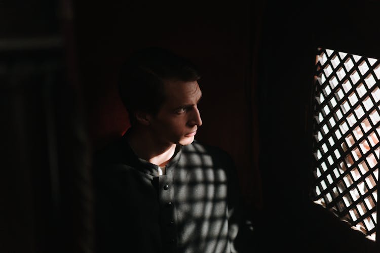 A High Angle Shot Of A Priest Inside The Confession Room