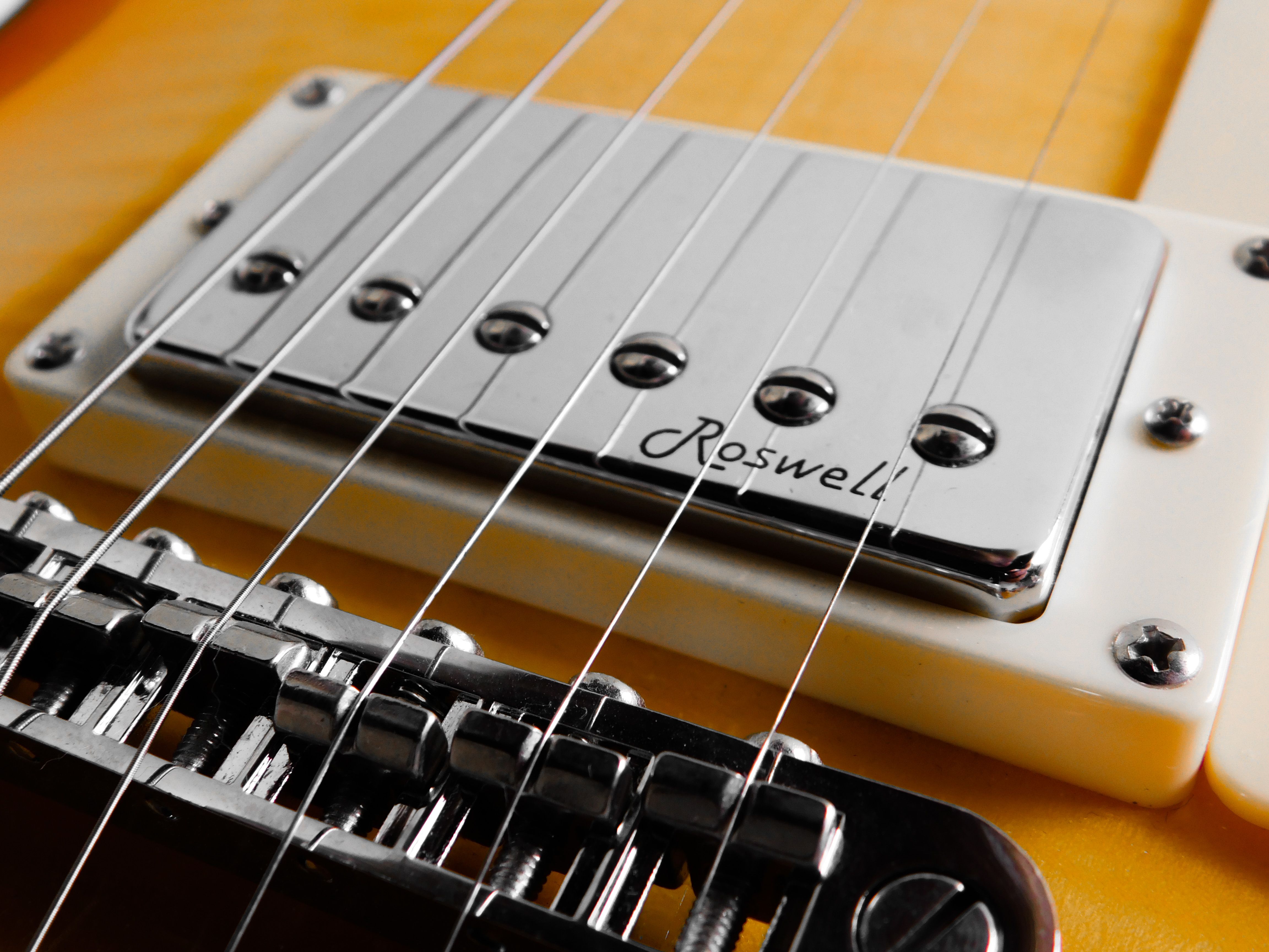 Close-up of electric guitar strings and bridge
