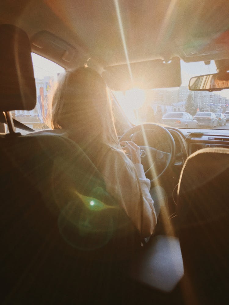 Light Blinding Woman Driving Car