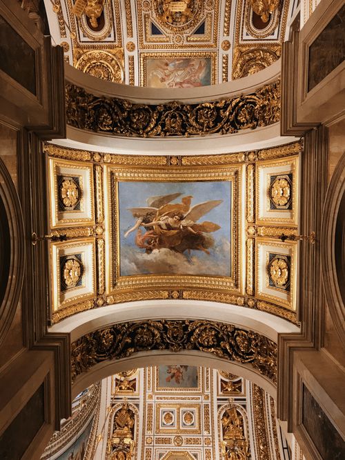 Free Intricate frescoes and gilded designs adorn the palace ceilings in St. Petersburg. Stock Photo