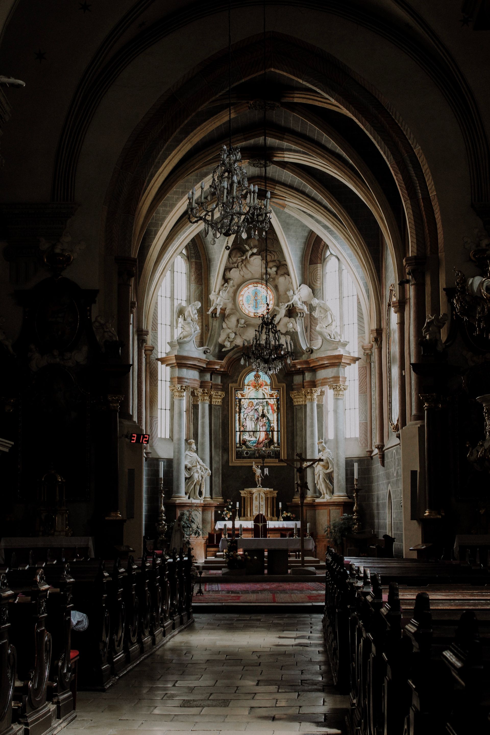 Serene cathedral interior with gothic architecture and altar