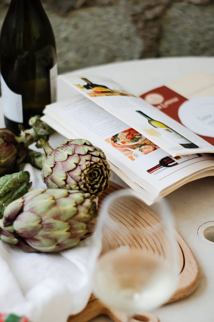 Artichokes And Wine Glass On Table