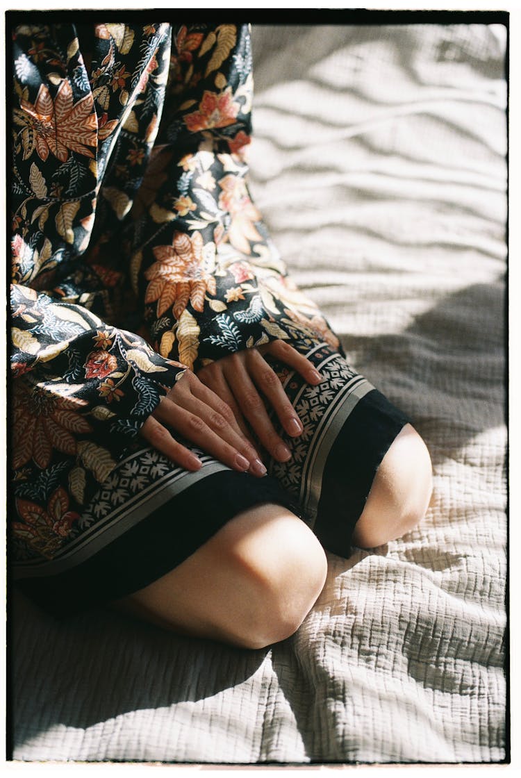 Woman In Floral Dress Kneeling