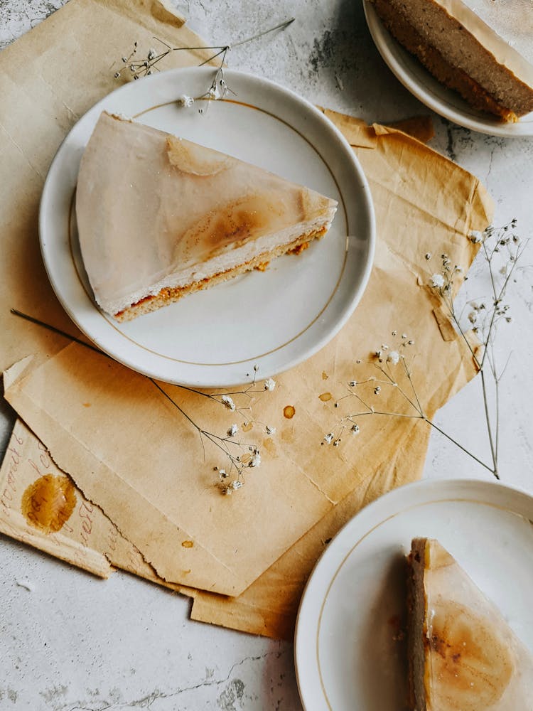 White Ceramic Plates With Sliced Cake