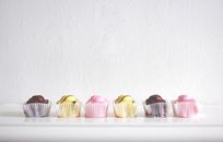 Six Cupcakes Near White Wall
