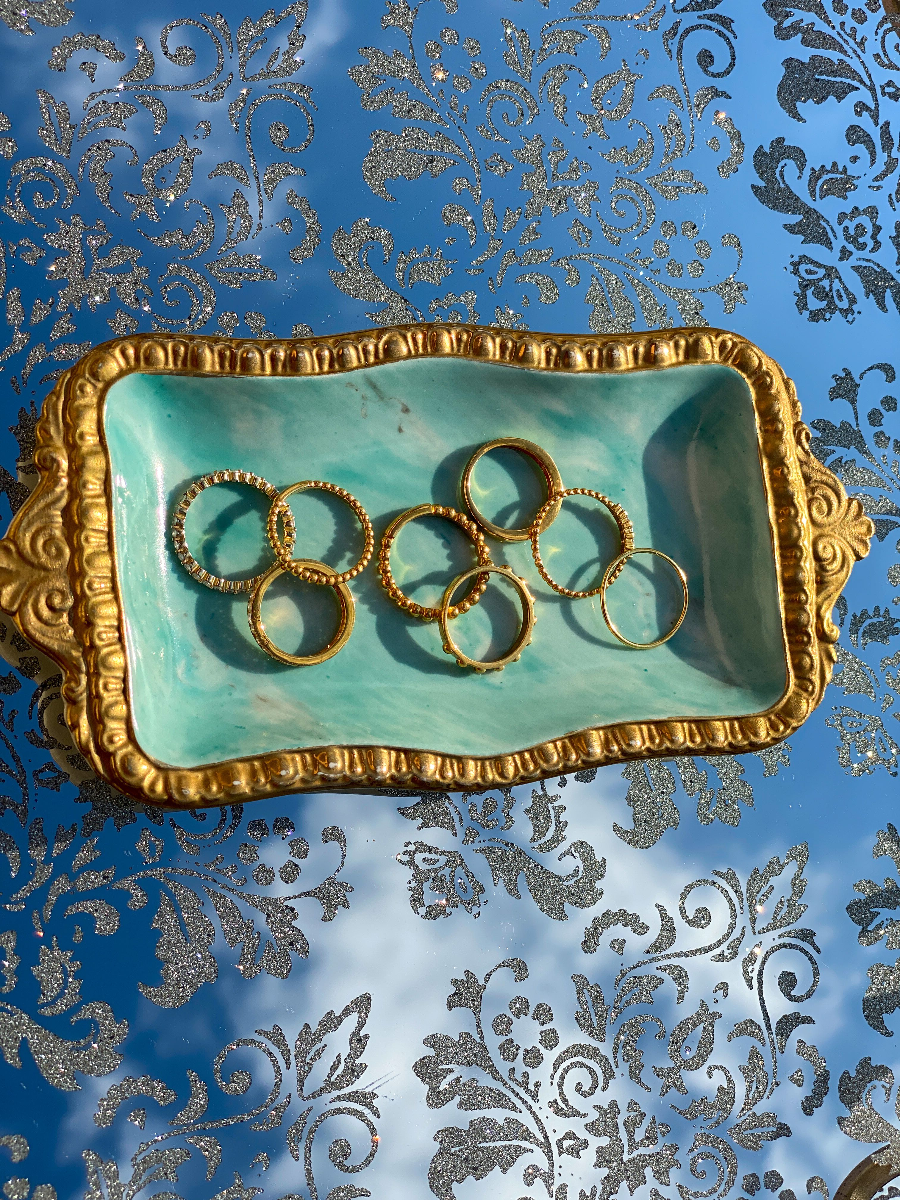 Assorted rings in a store tray for price comparison and shopping