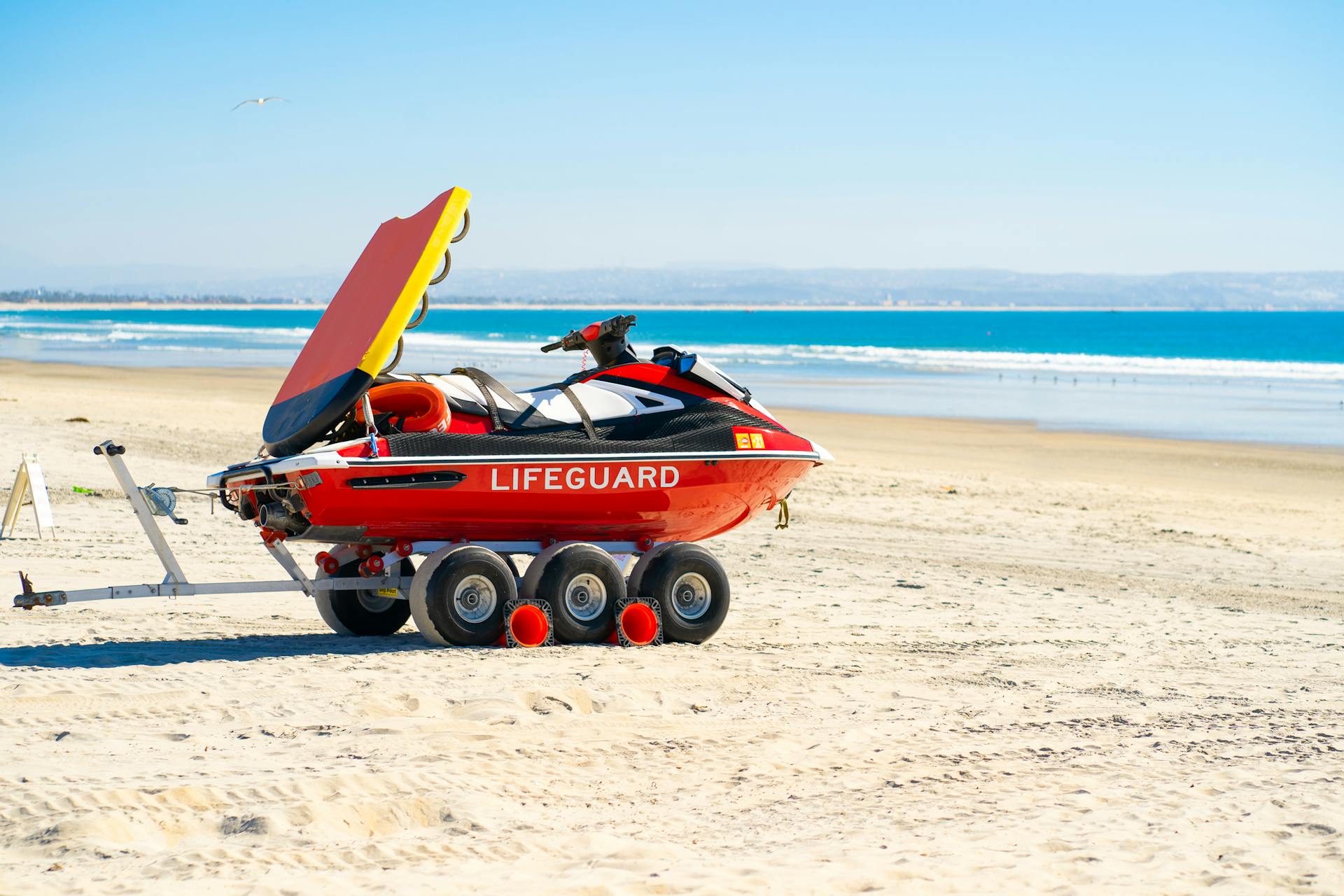 Red Jet Ski on Seashore