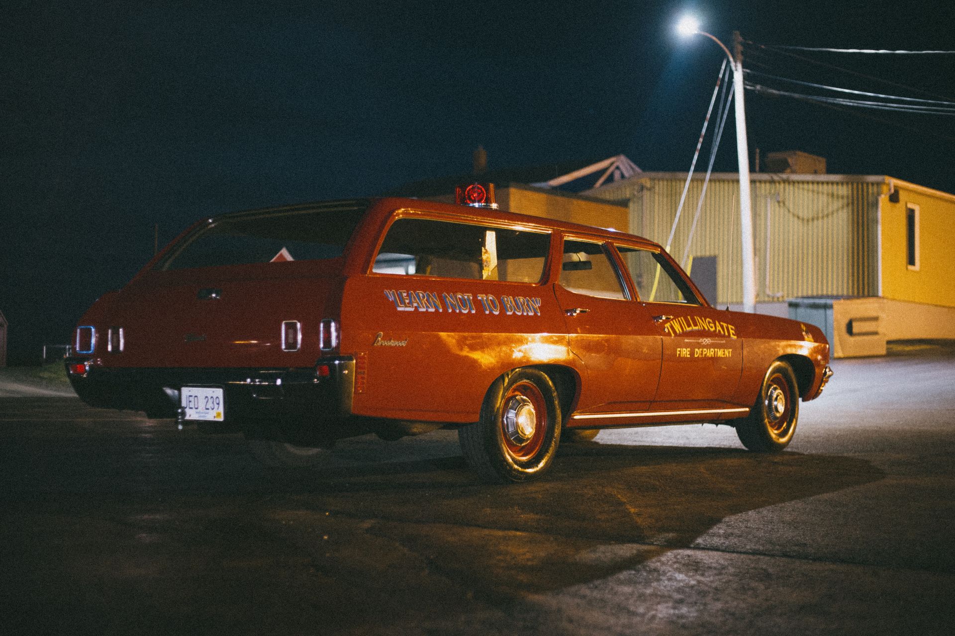 A Parked Red Station Wagon of the Fire Department