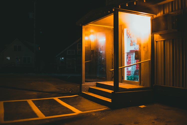 Illuminated Store Entrance At Night