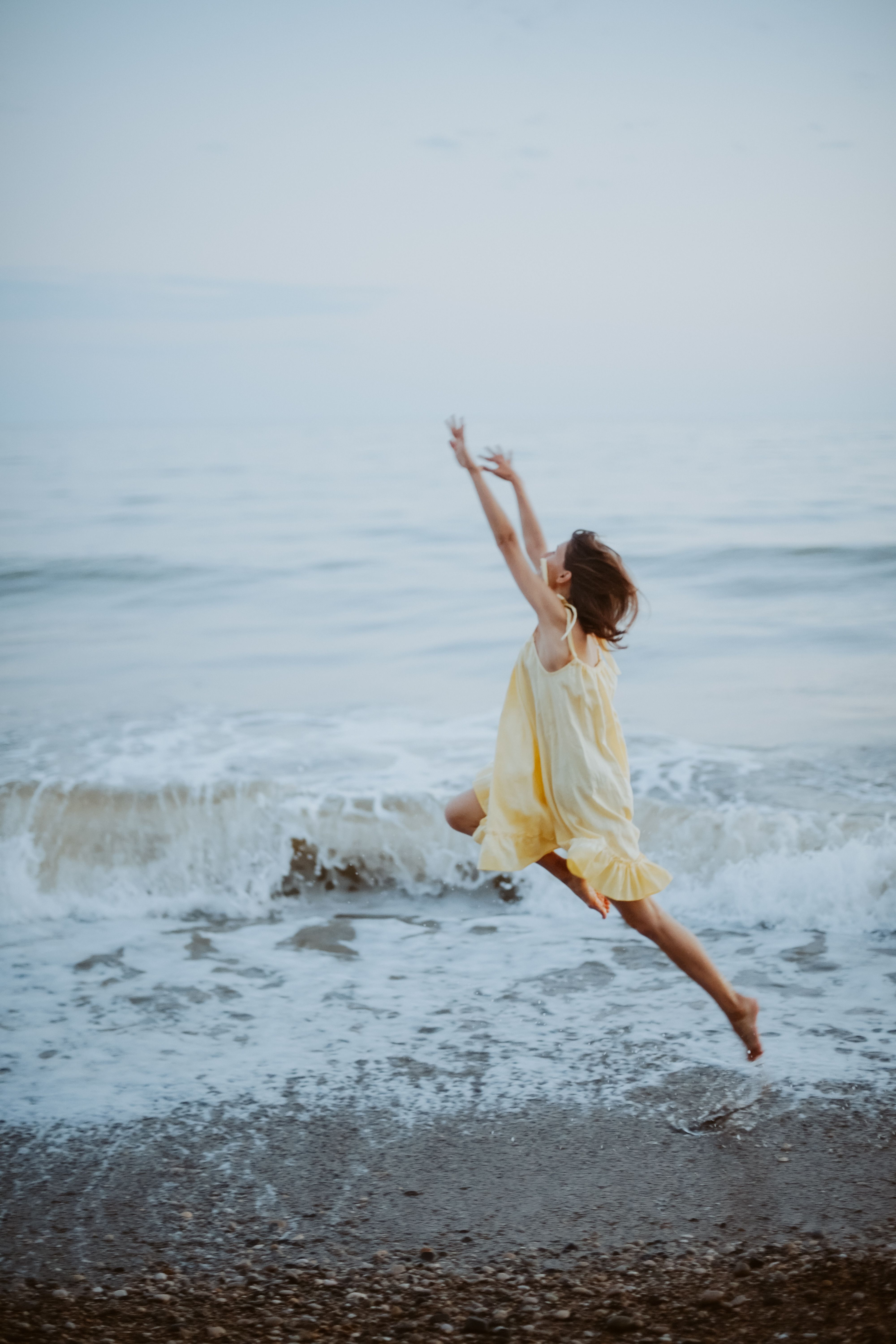 Woman in Yellow Dress Jumping on Beach · Free Stock Photo