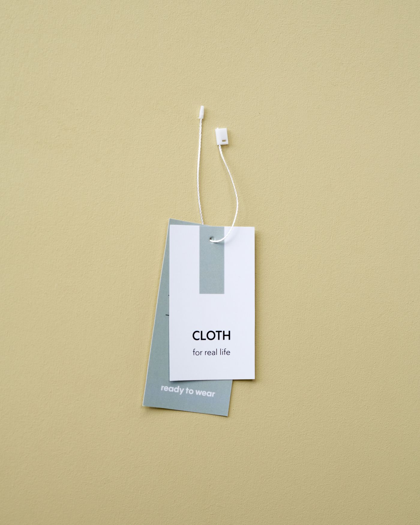 Clothing labels and garment tags arranged on a neutral background