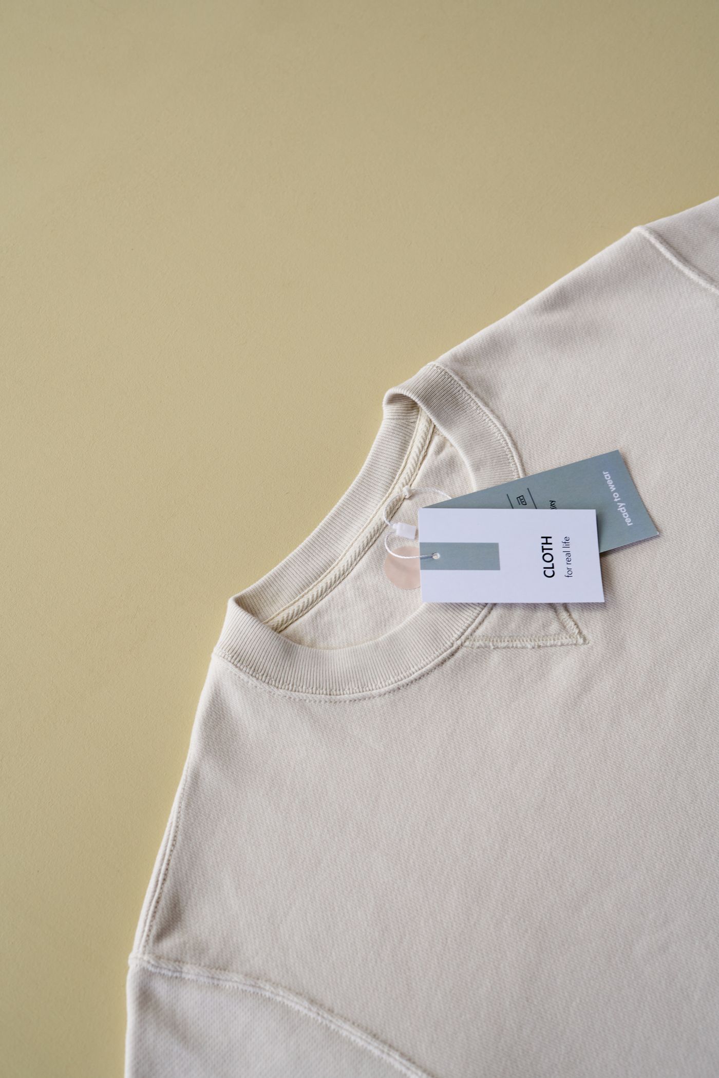 Plain crewneck sweatshirt laid flat for sample checking