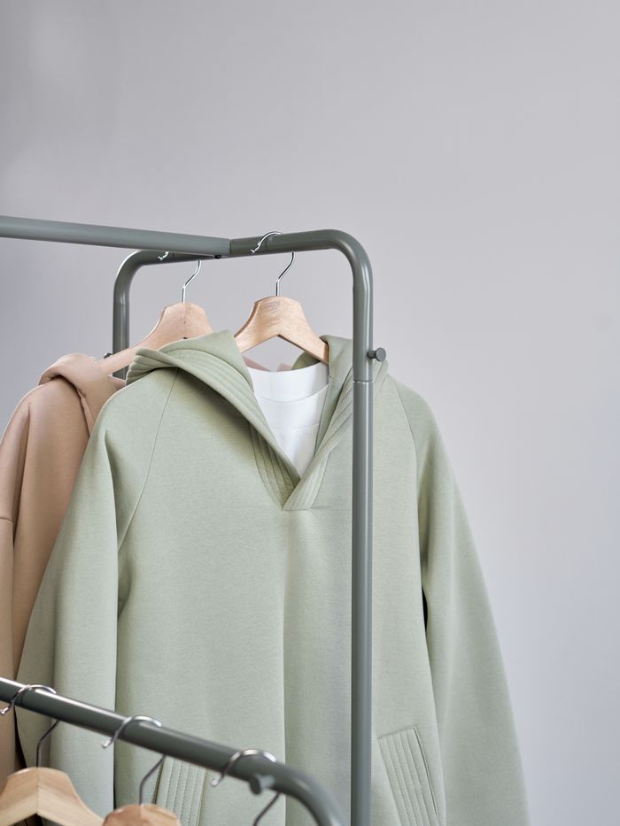 Sweatshirts on studio rails