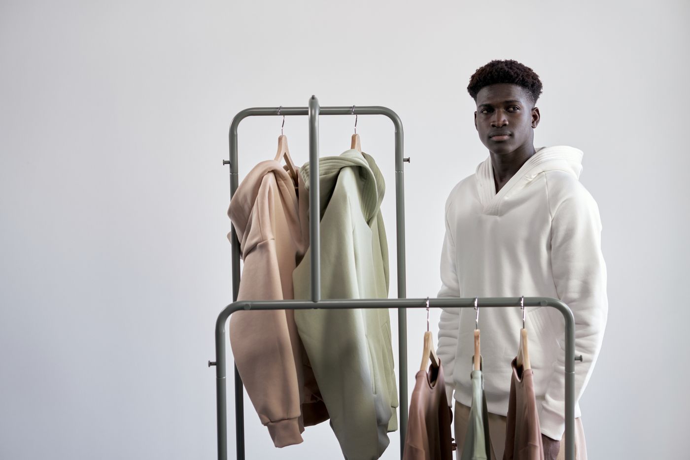 Rack of hoodies hanging in a minimalist shop