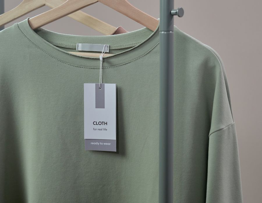 Garment on a hanger with a branded label tag