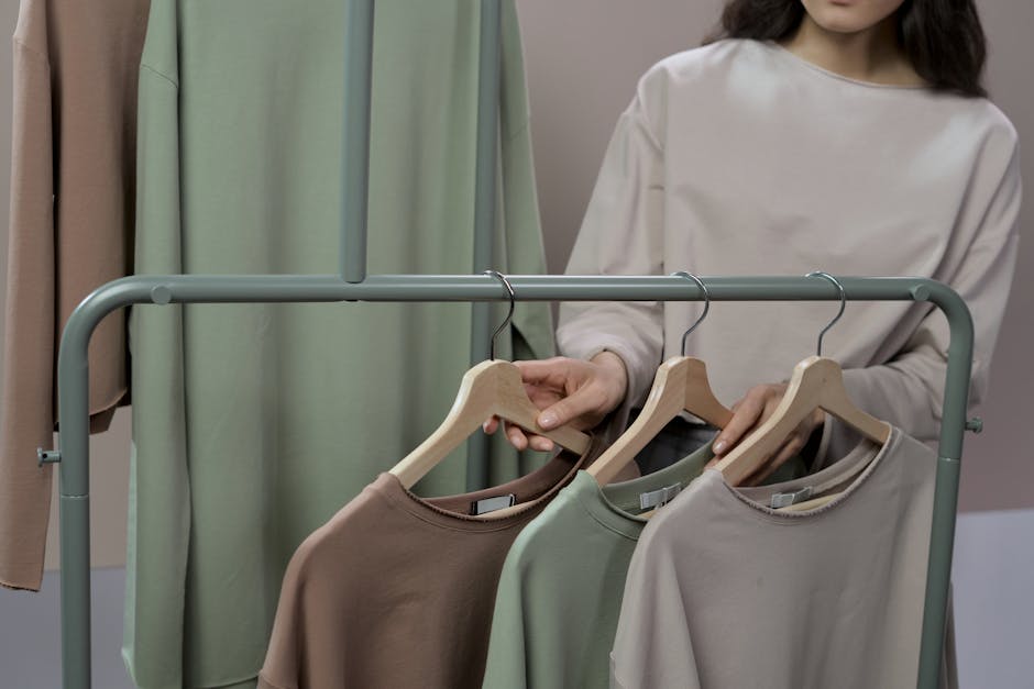 Pink Long Sleeve Shirt Hanging on White Metal Bar · Free Stock Photo
