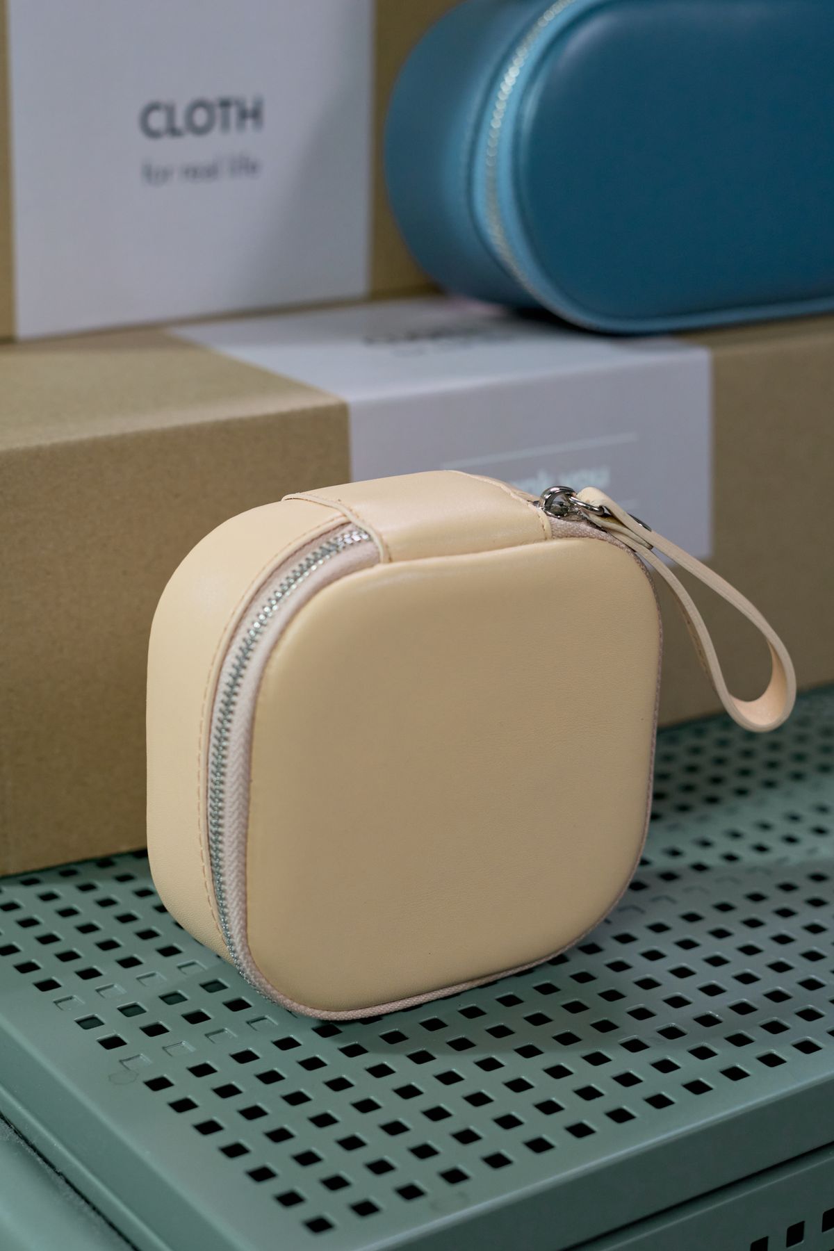 Lisette micro bag in bone leather on a pale shelf