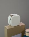 White and Brown Box on Brown Wooden Table