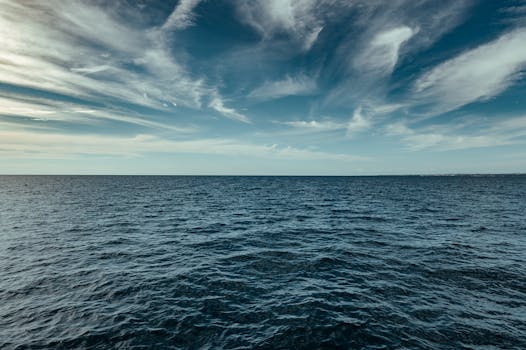Tranquil seascape with blue sky and clouds over the ocean, captured in Poreč, Croatia.