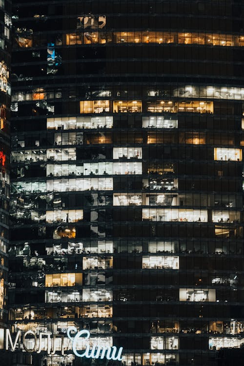 Black and White Concrete Building during Night Time