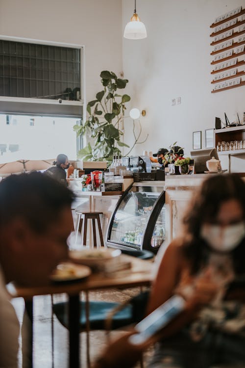 Free People Wearing Face Mask Inside the Café Stock Photo