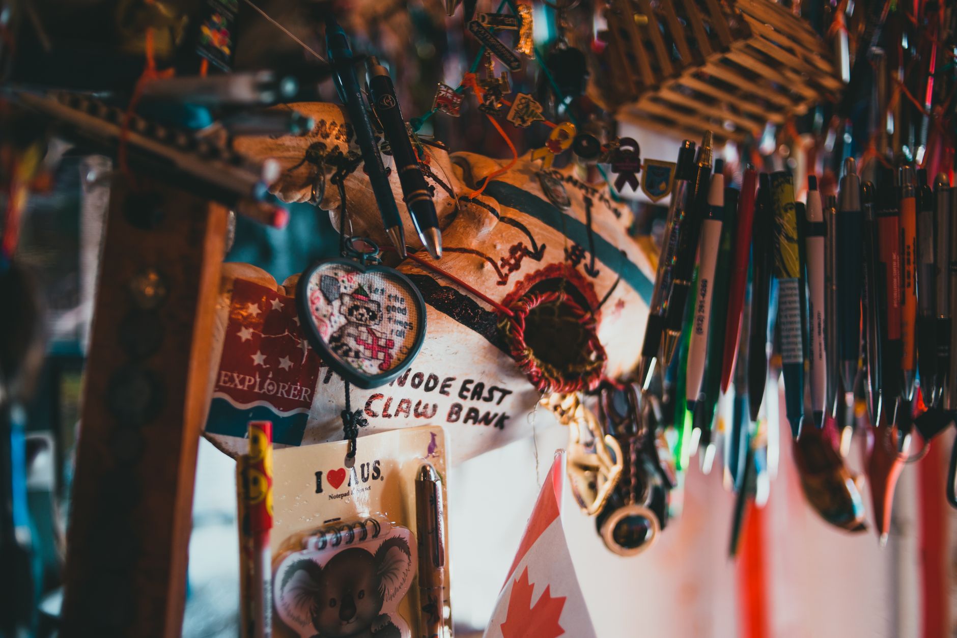 Assorted Pens and Items Hanging