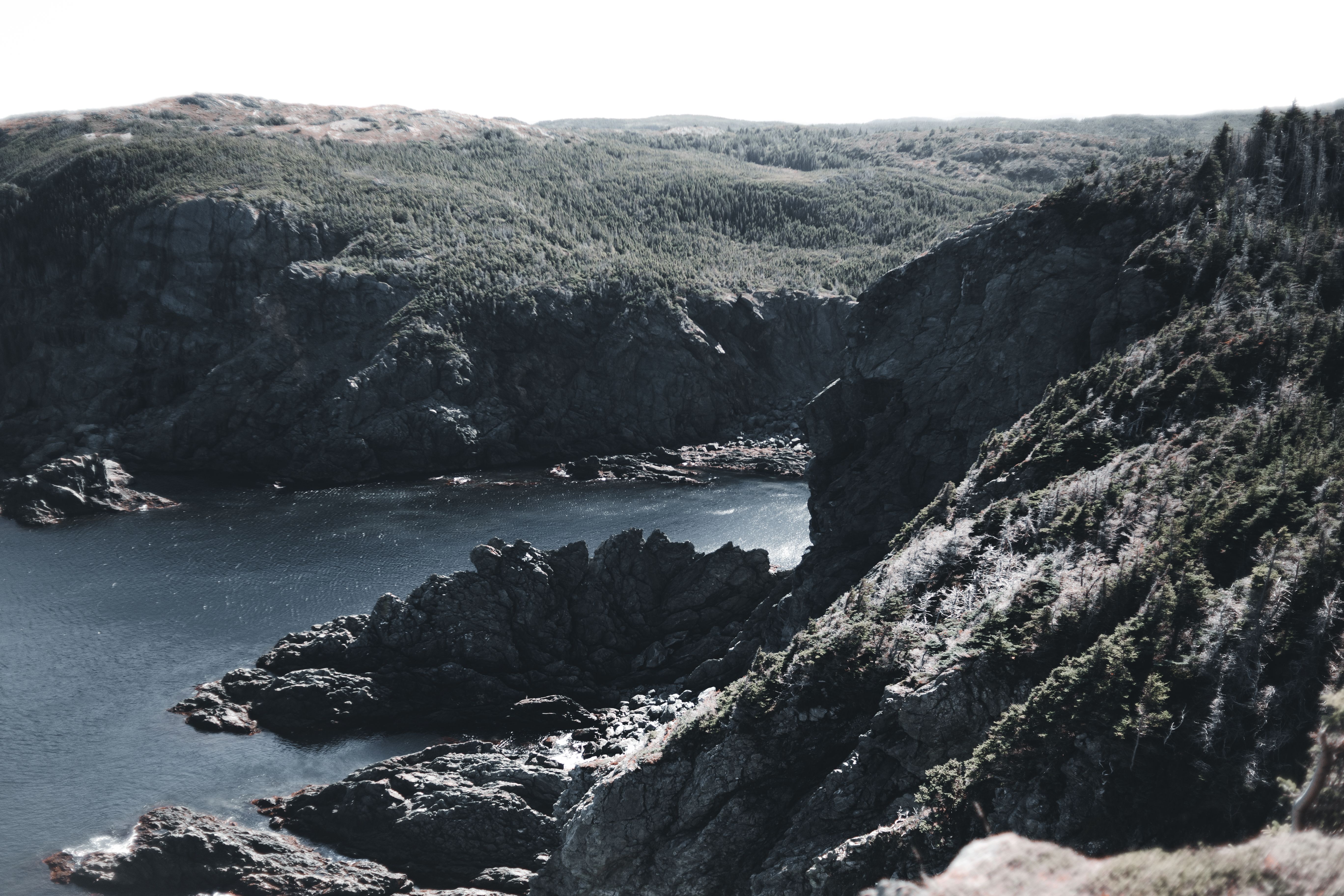 A Waterfalls and River Between Rock Formations · Free Stock Photo