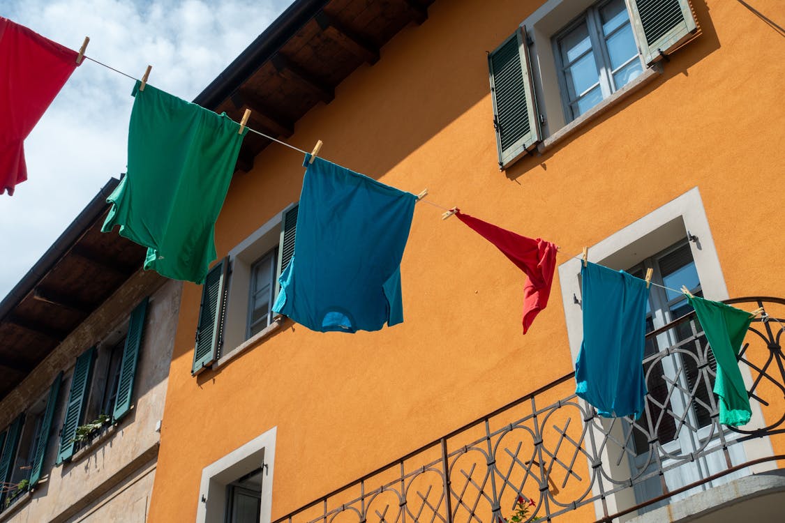 Clothes Drying on String near Building Wall