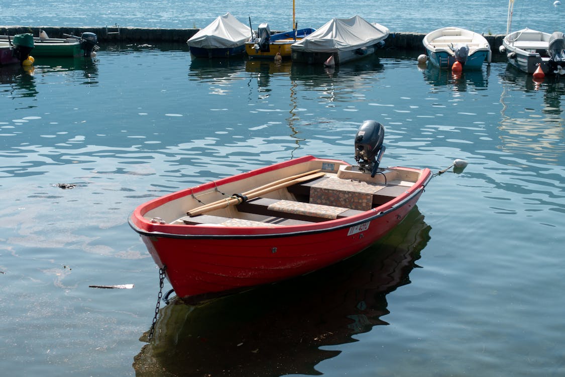 Close-Up Shot of Red Boat on Body of Water