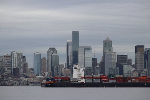 A Barge with Cargo Near Skyscrapers in Seattle, Washington, United States