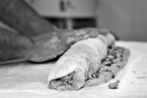 Free Close-up of hands preparing dough with nuts in a Moroccan kitchen setting, emphasizing traditional culinary techniques. Stock Photo